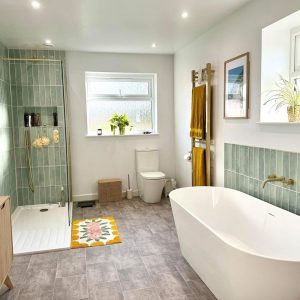 Freestanding bath and green-tiled walk-in shower β bathrooms by Fen Developments
