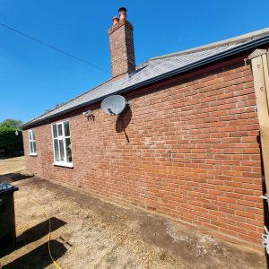 Brick bungalow wall with new roof β building work by Fen Developments