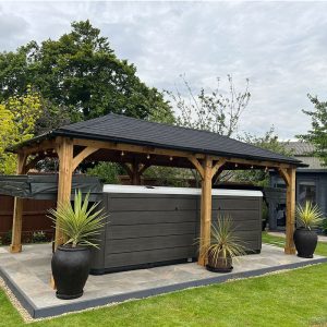 Timber gazebo with tiled roof over hot tub β building by Fen Developments